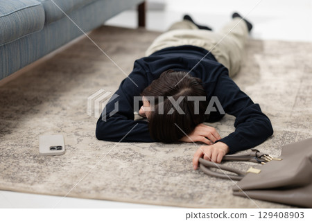 A tired woman falling asleep 129408903