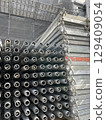 Scaffolding assembly work for large-scale apartment building repairs 129409054