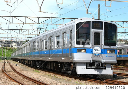 Odakyu Electric Railway 2000 series train parked at the depot (with 2000 series 30th anniversary commemorative headmark) Odakyu Electric Railway 2000 series train parked at the depot (with 2000 series 30th anniversary commemorative headmark) 129410320