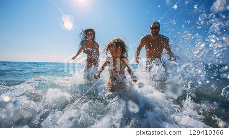Smiling family playing in the sea 129410366