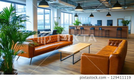 modern office lounge with leather sofas and plants 129411119