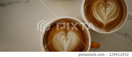 Cups of coffee decorated with a heart Cups of coffee decorated with a heart 129412032