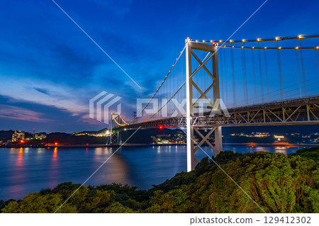 [Fukuoka Prefecture] Evening view of the Kanmon Strait and illuminated Kanmon Bridge from Mekari PA 129412302