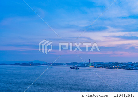 [Fukuoka Prefecture] Evening view of the Kanmon Strait and ships passing by from Mekari PA 129412613
