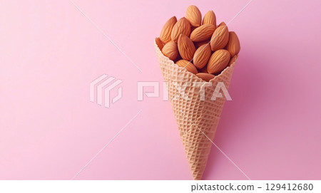 Almond nuts closeup healthy protein for snack or flour organic ingredient on cone wrapped container 129412680