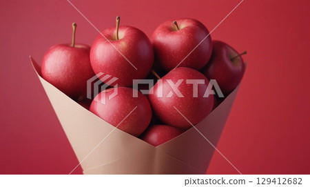 Red apple closeup organic natural snack healthy food on cone wrapped 129412682