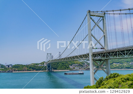 [Fukuoka Prefecture] Kanmon Strait, Kanmon Bridge, and ships passing by on a clear day as seen from Mekari PA 129412929