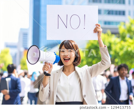 A woman shouting and holding a placard that reads "No!" 129413755