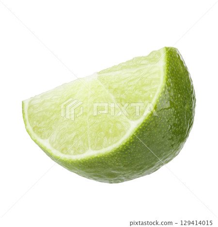 Green lime cut in half isolated on a white background Green lime cut in half isolated on a white background 129414015