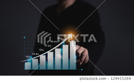 Young man with smartphone mobile hand hold a pen touching to visualize money growth 129415269
