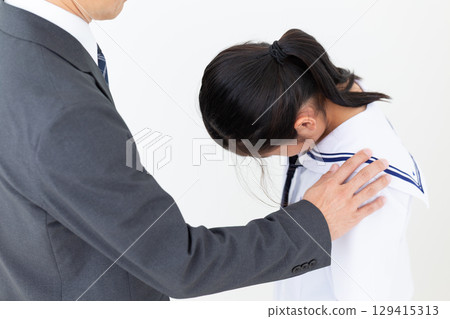 A father comforts his depressed middle school daughter A father comforts his depressed middle school daughter 129415313