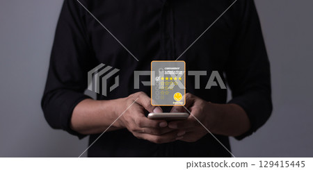 Customer Review, Young Man hand holding Smart Phone with five star to review and give 5 stars Customer Review, Young Man hand holding Smart Phone with five star to review and give 5 stars 129415445