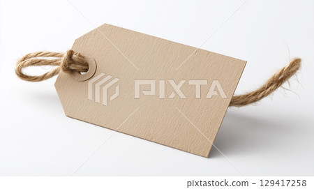 Blank brown paper gift tag with twine for a rustic or handmade product 129417258