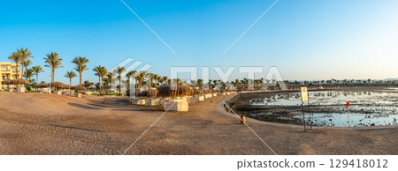 Golden Sunset Over Marsa Alam Resort with Palm Trees Golden Sunset Over Marsa Alam Resort with Palm Trees 129418012