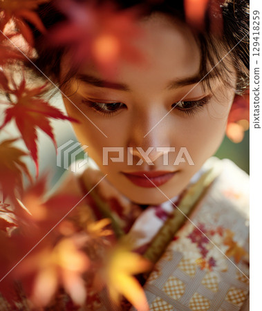Autumn leaves and a woman wearing a kimono Autumn leaves and a woman wearing a kimono 129418259