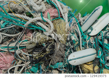 Various types of fishing nets are tangled 129419373