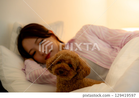 woman sleeping in bed woman sleeping in bed 129419597