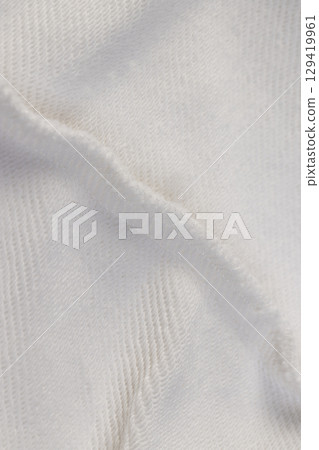 seams on white material , piece of clothing sewn from different parts 129419961