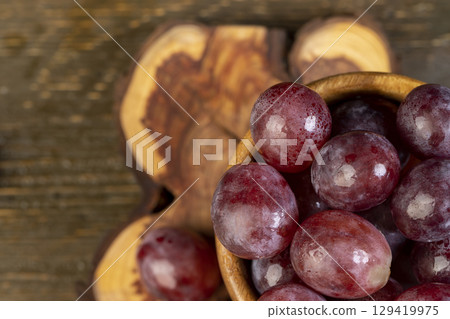 wet grapes after washing the berries, clean wet grapes safe for eating, top view 129419975