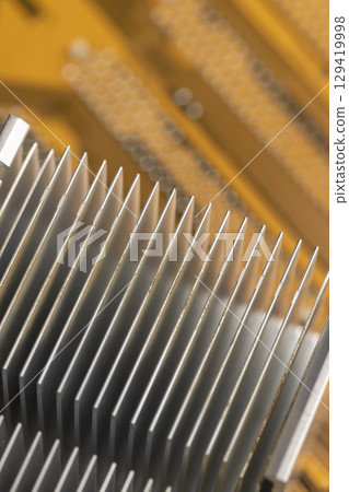 aluminum radiator for cooling modern devices, part of an old used cooling system in the form of a metal alloy radiator, close up 129419998