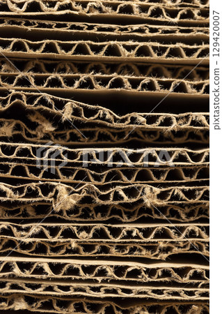 old Multilayer cardboard for boxes , stacked large amounts of corrugated cardboard after use in transportation old Multilayer cardboard for boxes , stacked large amounts of corrugated cardboard after use in transportation 129420007
