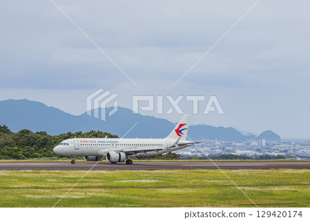 An airplane running on the runway at Mt. Fuji Shizuoka Airport in Makinohara City (Shizuoka Prefecture) 129420174