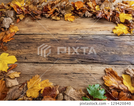 Background material of an old wooden floor covered with dead leaves (autumn atmosphere) 129420840