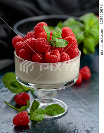 Mascarpone cream with fresh raspberries in a clear bowl. Mascarpone cream with fresh raspberries in a clear bowl. 129420978