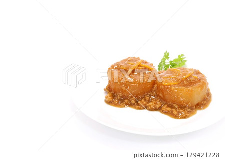 Daikon radish with minced meat sauce on a bright background 129421228