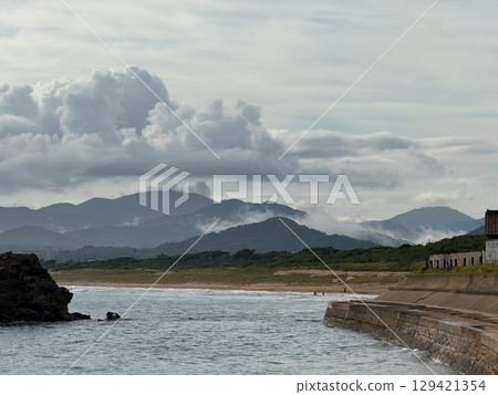 Morning mist over Kumihama and the mountains 129421354
