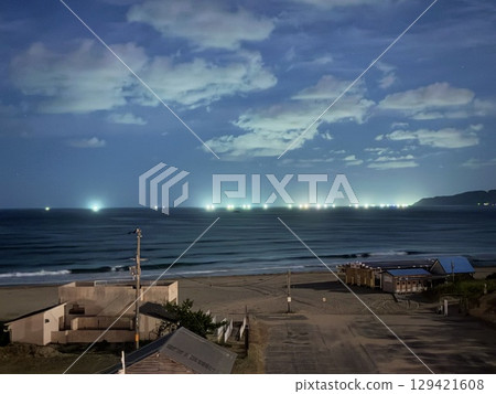 Kumihama at night and fishing lights on the horizon 129421608
