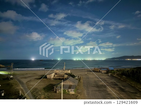Kumihama at night and fishing lights on the horizon 129421609