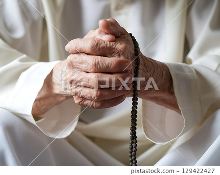 Elderly Hands in Prayer Holding Traditional Prayer Beads Elderly Hands in Prayer Holding Traditional Prayer Beads 129422427