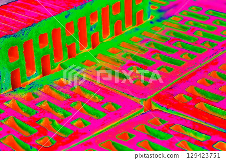 Stack of red bricks for construction, hollow brick.  129423751
