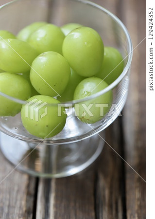 Freshly picked Shine Muscat grapes in a dessert glass 129424352