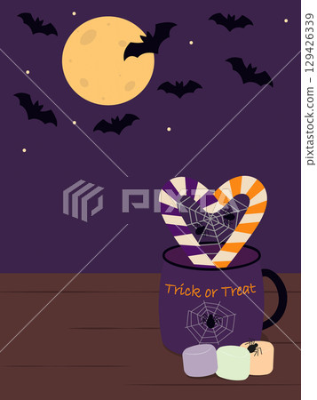 Candy Canes shape Heart with Spiders on Web in Halloween Mug near Marshmallow on Bats and moon Fond 129426339