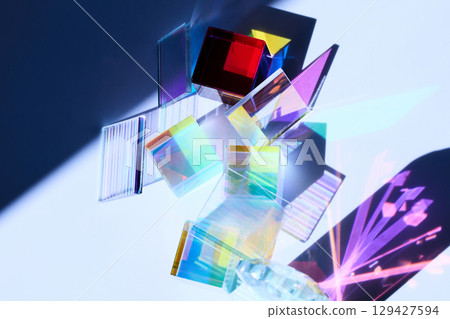 Prismatic Reflections. Colorful glass prisms casting vibrant shadows and reflections 129427594
