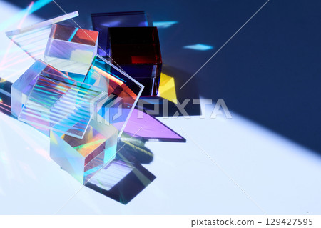 Prismatic Reflections. Colorful glass prisms casting vibrant shadows and reflections 129427595