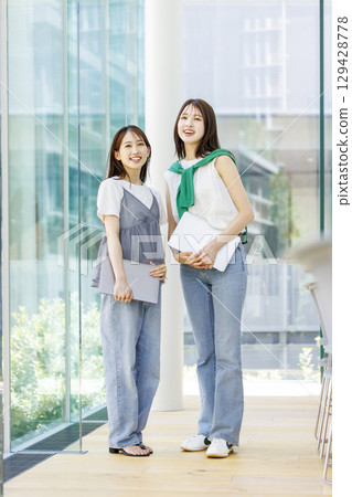 Students standing in a university classroom 129428778