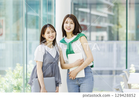 Students standing in a university classroom 129428852