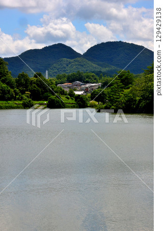 Sanda City: The Arima mountains and thatched roof houses reflected in the Fukushima Oike Pond Sanda City: The Arima mountains and thatched roof houses reflected in the Fukushima Oike Pond 129429138