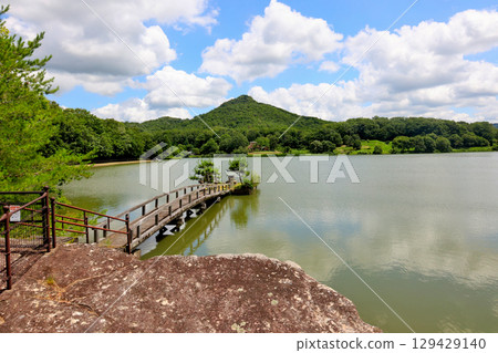 Arima Fuji and thatched roof houses reflected in the Fukushima Oike Pond in Sanda City Arima Fuji and thatched roof houses reflected in the Fukushima Oike Pond in Sanda City 129429140