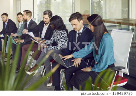 Office Team Collaborating And Communicating During Group Meeting 129429785