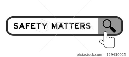 Search banner in word safety matters with hand over magnifier icon on white background 129430025