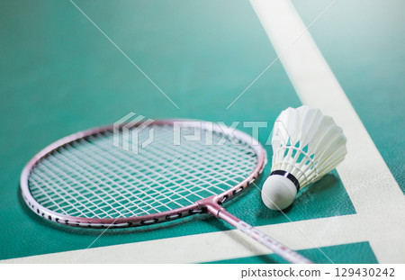 3. Shuttlecock and Racket on Badminton Court Background 129430242