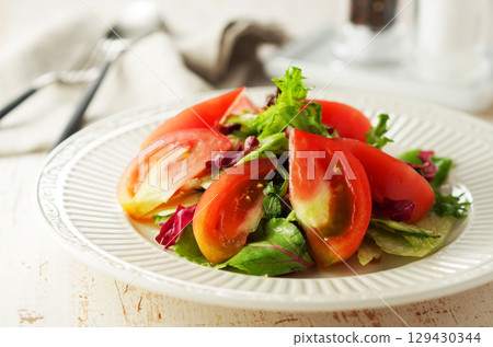 Mixed vegetable and tomato tossed salad Mixed vegetable and tomato tossed salad 129430344