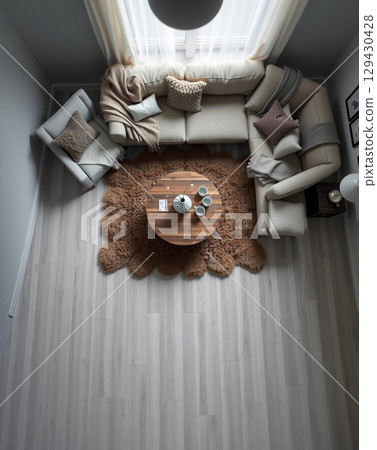 Cozy Living Room Interior with Natural Light and Warm Tones 129430428