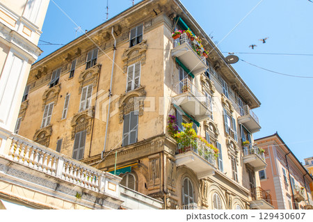 Yellow houses street in La Spezia city. Italian old town center. Old balcony architecture 129430607