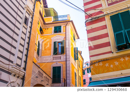Colorful houses buildings. Monterosso Italian village. Cinque Terre narrow street architecture, Liguria, Italy. Colorful houses buildings. Monterosso Italian village. Cinque Terre narrow street architecture, Liguria, Italy. 129430668