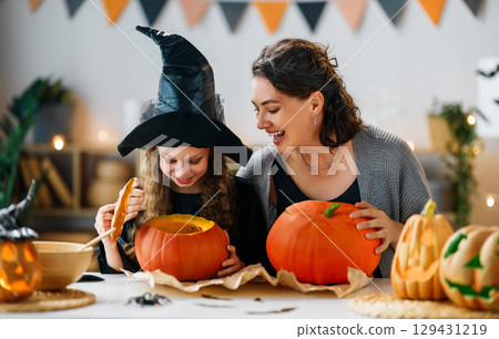 Happy family preparing for Halloween. 129431219